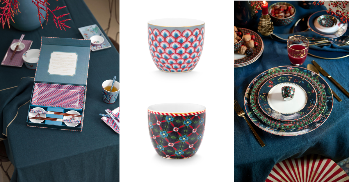 prostřený stul s kolekcemi Pip Studio Berry Blues a Flower Festival v odstínech modré s velkými květy, sushi set, hůlky, tmavě modré talíře velké, cukřenka, modrý ubrus, kalíšek na vajíčka nádobka na saké